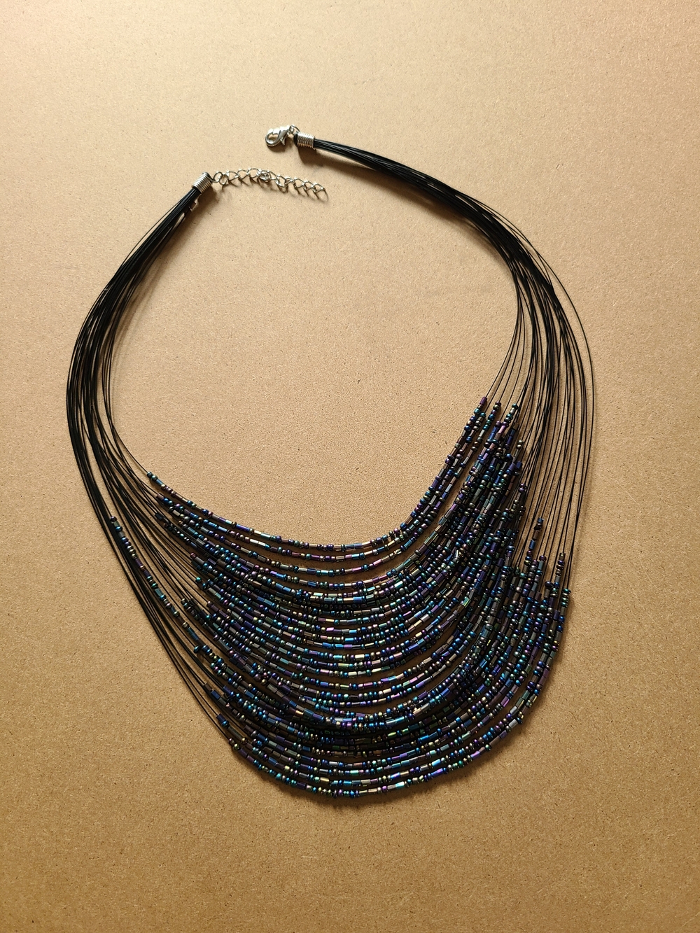 Multi-Strand Black Beaded Statement Necklace - Iridescent Blue Accents